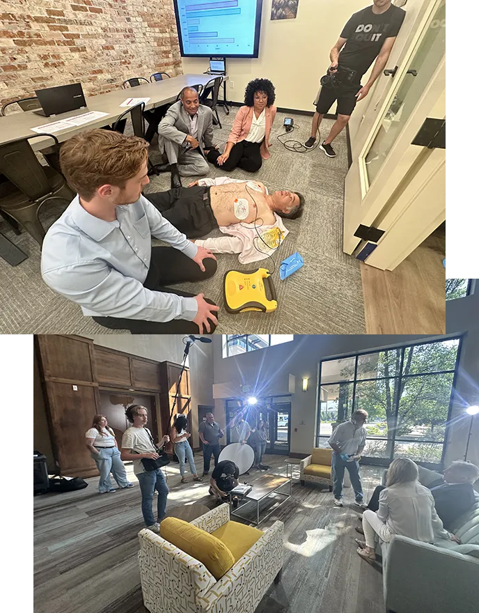 Cardio Crew 2 Two behind the scenes photos of a training and eLearning video production for medical training. One on top shows a board room with a man lying on his back with his shirt open and a defibrillator attached to his chest. The bottom photo shows the cast in crew hanging out on location in a large hotel lobby.